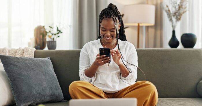 Happy,,Black,Woman,And,Credit,Card,With,Phone,On,Sofa