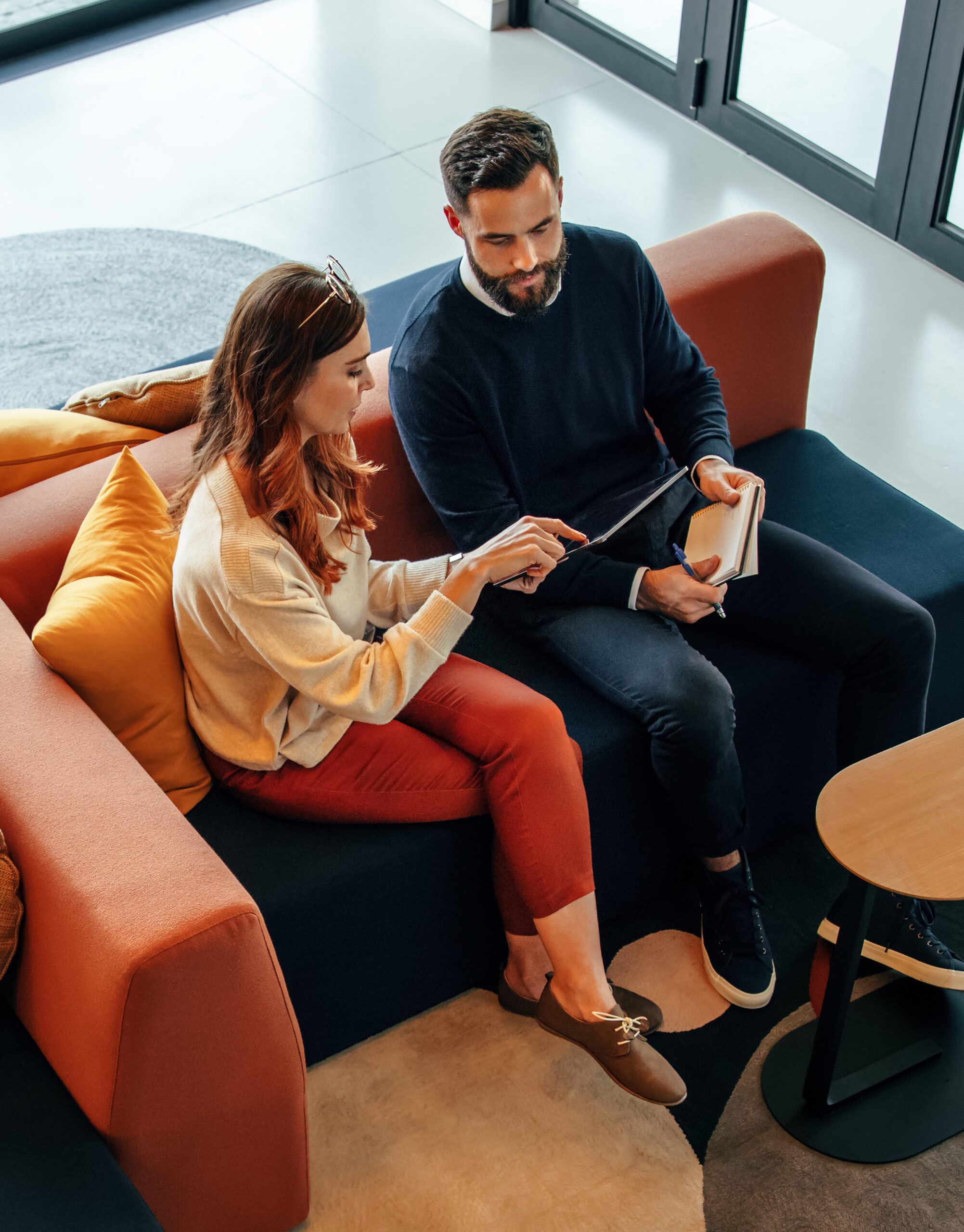 High,Angle,View,Of,Two,Businesspeople,Working,In,An,Office